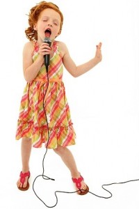 Adorable Child Singing into Microphone